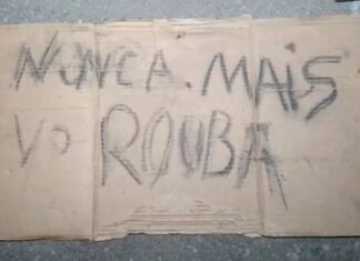 Homem é amarrado e deixado ao lado de placa com ameaça contra roubos